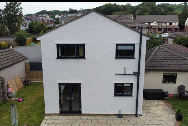 After: Rear elevation: stained walls repaired and refinished